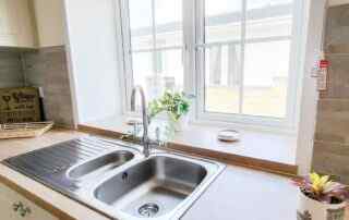 Plot 11 - Cardigan Cottage - view of the kitchen sink and window - Crowsheath Estate Luxury Park Homes and Lodges in Essex