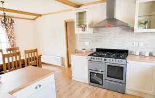 Plot 11 - Cardigan Cottage - view of the kitchen diner with range cooker - Crowsheath Estate Luxury Park Homes and Lodges in Essex