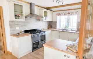 Plot 11 - Cardigan Cottage - wide view of the kitchen diner with range cooker - Crowsheath Estate Luxury Park Homes and Lodges in Essex